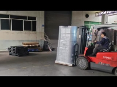 Operating the forklift to put the nonwoven fabrics into the container